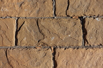 Close view of light brown brick veneer wall