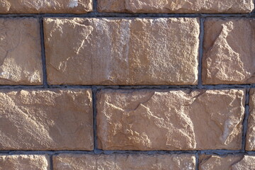 Close shot of pinkish brown brick veneer wall