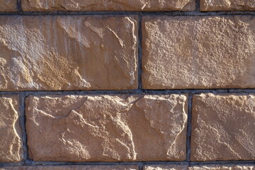 Texture of pinkish brown brick veneer wall