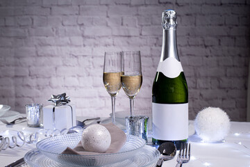 wine champagne bottle on a christmas party holiday table with empty label copy space