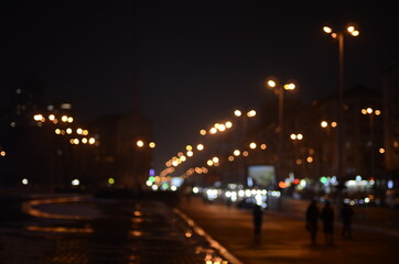 Fototapeta na wymiar Blurred lights of night city shallow depth of field