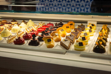 Pastries filled with Cream and Chocolate displayed in a pastry Shop Showcase