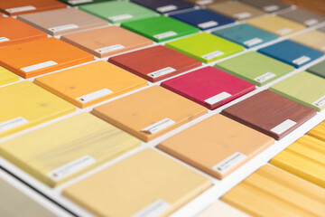 a palette of bright multi-colored wooden blocks painted with terraced oil, a palette for wood...