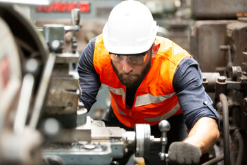 Industrial Engineers in Hard Hats.Work at the Heavy Industry Manufacturing Factory.industrial worker indoors in factory.aged man working in an industrial