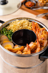 Hokkien mee or Prawn noodle are tossed in pork lard and served with fish balls, shrimp.

Hokkien mee is a Southeast Asian dish that has its origins in the cuisine of China's Fujian (Hokkien) province