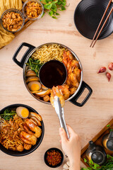 Hokkien mee or Prawn noodle are tossed in pork lard and served with fish balls, shrimp.

Hokkien mee is a Southeast Asian dish that has its origins in the cuisine of China's Fujian (Hokkien) province