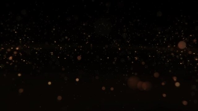 4k Gold Particles Explosion. Xmas Motion Background. Golden glitter particle. Isolated on black. Animated Overlay. 2022 New Year. 