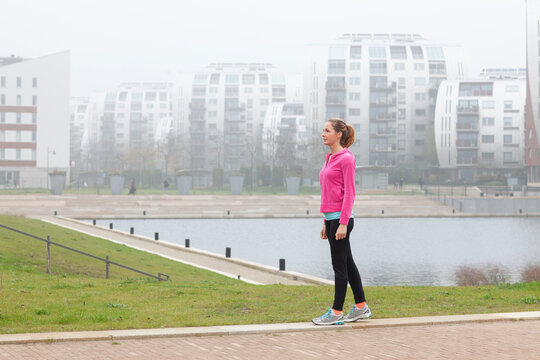 Woman walking on footpath