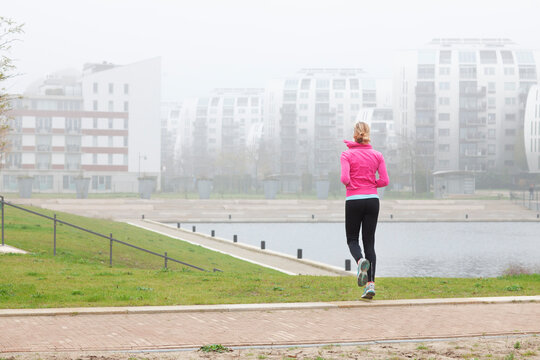 Woman exercising while jogging at park