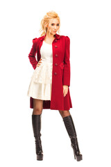 Young beautiful blonde woman in red coat