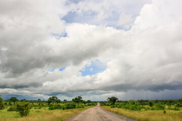 road through open country with clouds