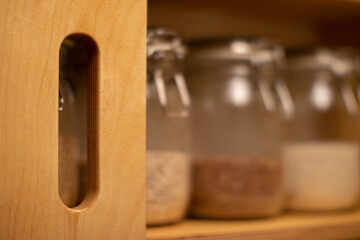 plywood cabinet with grain bottles
