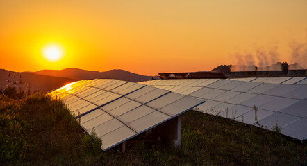 Sun setting over solar farm