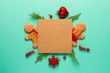 Christmas composition with decorations and cookies on a mint background with space for text