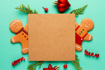 Christmas composition with decorations and cookies on a mint background with space for text
