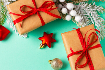Christmas composition with decorations and ornaments on a mint background