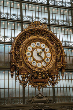 Paris, France - July 11, 2017. Golden clock view at the main hall of the Quai d'Orsay Museum in Paris. Known as the &ldquo;City of Light&rdquo;, is one of the most awesome world's cultural center. Northern France