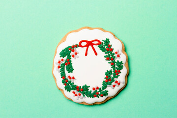 Christmas composition with decorations and cookies on a mint background