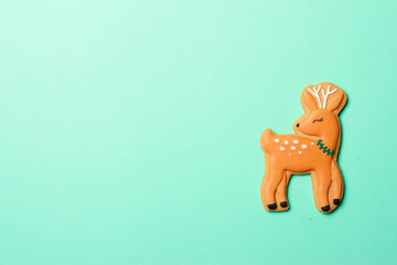 Christmas composition with decorations and cookies on a mint background