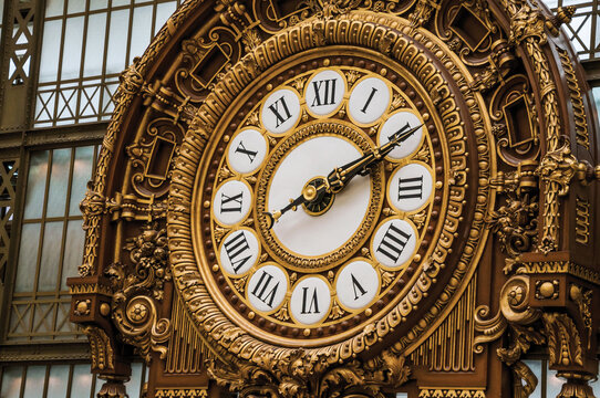 Paris, northern France - July 11, 2017. Close-up of golden clock at the Quai d'Orsay Museum main hall in Paris. Known as the &ldquo;City of Light&rdquo;, is one of the most awesome world's cultural center.