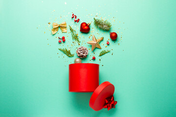 Christmas composition with decorations and ornaments on a mint background