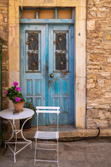 Old Greek house with blue door on Symi island in Greece