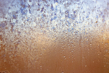 Abstract background. Drops on window glass. Color image.