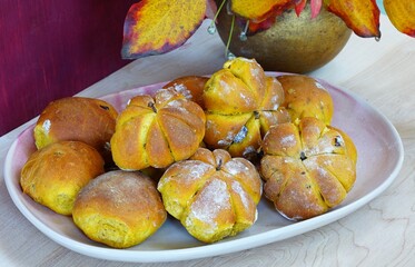 Pumpkin shaped buns with pumpkin seeds and dried cranberries