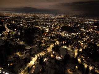 night city photo of oslo, norway a winter night. shot with a drone high up in the sky