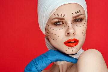 woman posing in blue gloves red lips surgery facial rejuvenation isolated background