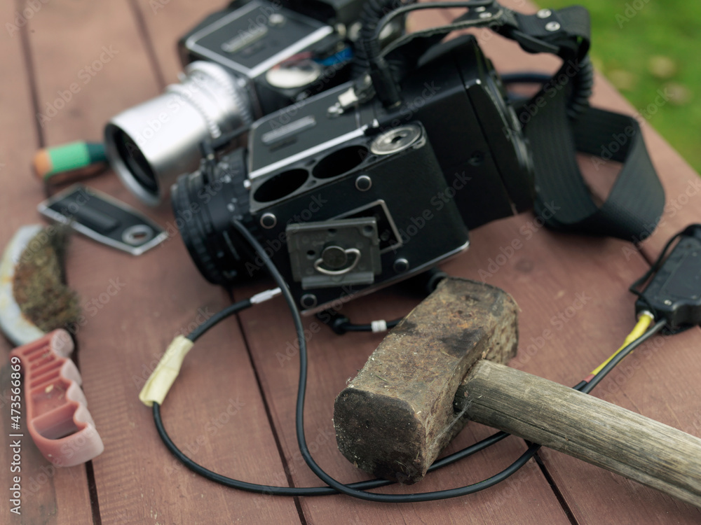 Wall mural photo camera with hammer