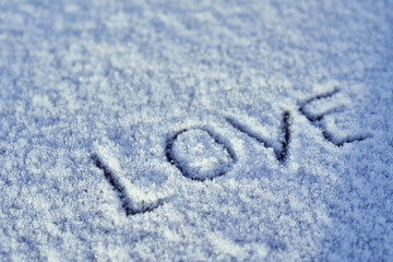 Love writing on the fresh snow, heart symbol