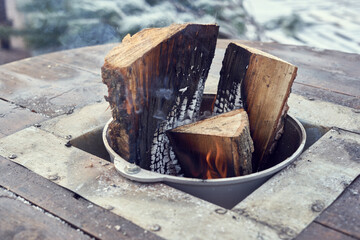 Smoking firewood in the street kitchen, holiday market