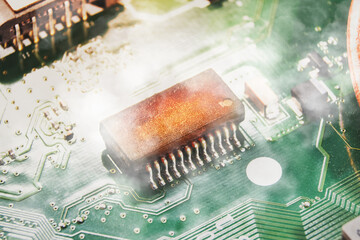 Integrated circuit (IC) burns and smoke on the electronic circuit board of the computer...