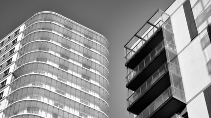 Abstract fragment of contemporary architecture. Residential area in the city, modern apartment buildings. Black and white.  - obrazy, fototapety, plakaty