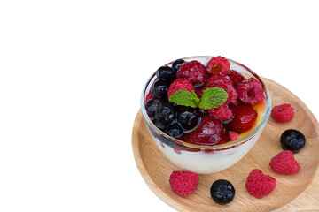 Fruit yogurt has strawberry raspberry blueberry canberry and honey greek white clean In bowl on a wooden background from top view.
