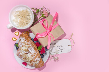 Obraz na płótnie Canvas Croissant with coffee and and Valentines gift