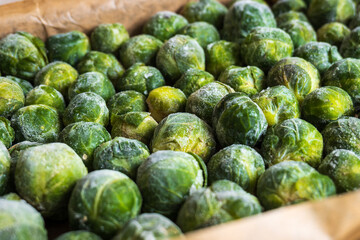 frozen frosty look brussels sprouts on baking tray closeup