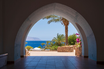 Beautiful arched doorway in a building on the shores of the Red Sea at morning in the resort town of Sharm El Sheikh, Egypt, Africa