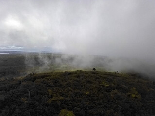 Aerial view of mist on top of Cocotte mountain (Mount Cocotte) located near Plaine Champagne, Mauritius