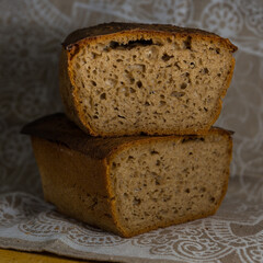 Homemade black rye bread on a napkin.