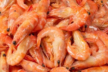 Shrimps background texture. A lot of shrimps. Cooked shrimps.
