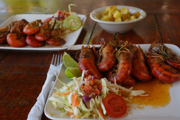 BBQ seafood with green salad and sauce