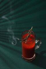 Bloody Mary cocktail - vodka and tomato juice, a sprig of rosemary