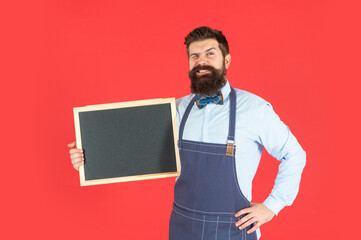 Promotional advertising. Winking man smile holding promo blackboard. Advertising promotion