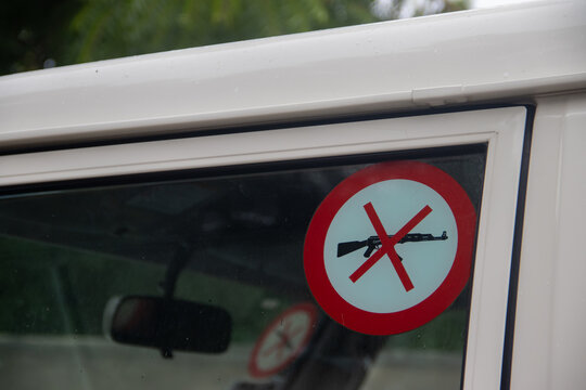 No guns policy and rules sticker on vehicle, humanitarian workers, impartiality and neutrality