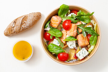 Close up of salad sauce and bread near plate