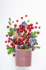 Composition - a berry fountain from a pink cup.