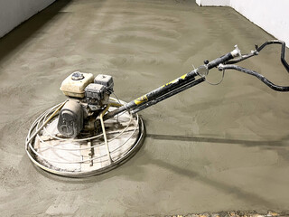 Grinding of the floor after filling with a gasoline grout machine. Grinding of the flooded floor...