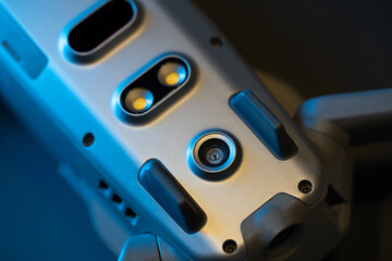 An inverted Mavic 2 Pro quadcopter on a black background in blue light. Infrared sensors and sensor...